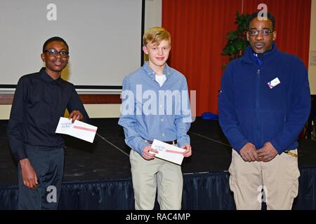 (From left), Mr. Anthony Malik Thompson, Mr. Alex Wepper, of the Vicenza High School, and Assistant Manager of the Vicenza AAFES, Mr. Kim Burton, pose for a photo, during Martin Luther King, Jr. Day, at Vicenza Military Community’s 2017 Observance Ceremony at Caserma Ederle, Vicenza, Italy, Jan. 10, 2017. Stock Photo