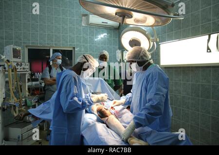 U.S. military and Senegalese medical professionals partner together to perform a surgery during Medical Readiness Training Exercise 17-1 at La Sante des Armees Hospital in Dakar, Senegal, Jan. 10, 2017. MEDRETE is a combined effort between the Senegalese government, U.S. Army Africa, the U.S. Army Reserve 332nd Medical Brigade in Nashville, Tenn., and the Vermont Air National Guard. MEDRETE 17-1 is the first in a series of medical readiness training exercises that U.S. Army Africa is scheduled to facilitate within various countries in Africa, and serves as an opportunity for the partnered mili Stock Photo