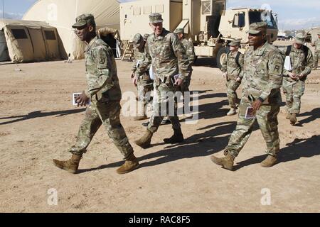 Brig. Gen. Xavier Brunson, deputy commanding general, 10th Mountain Division, Brig. Gen. Kenneth Kamper, deputy commanding general, 4th Infantry Division, and Lt. Gen. Stephen M. Twitty, commanding general, First Army, walk through 1st Armored Division headquarters' command post at Fort Bliss, Texas, Jan. 18, 2017. Stock Photo