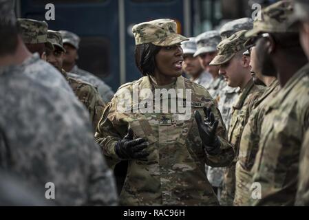 First Sgt. Selena McJimson, of Virginia Beach, Virginia, headquarters company first sergeant for the 3rd Transportation Brigade (Expeditionary), gives final instructions to her troops after a practice parade march on Joint Base Myer-Henderson Hall, Virginia, on Jan. 19 in preparation for the upcoming Presidential Inauguration Parade in Washington, D.C. During rehearsals, U.S. Army Reserve Soldiers practiced with members of the 3rd U.S. Infantry Regiment (The Old Guard), the U.S. Army Field Band, West Point and the D.C. National Guard, which totaled approximately 500 service members and cadets. Stock Photo