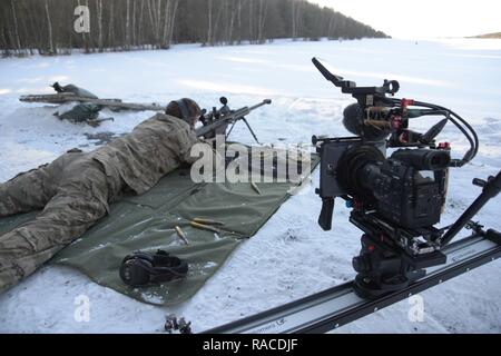 The photograph displays Training Support Activity Europe’s (TSAE) video gear set up during a 2nd Cavalry Regiment, 1st Squadron's live fire exercise with an M107 sniper rifle at the 7th Army Training Command's (7th ATC) Grafenwoehr Training Area, Germany, Jan. 20, 2017.     TSAE’s mission is to Identify, to acquire, to manage and to provide state-of-the-art home station, rotational and expeditionary training support and visual information capability as directed by United States Army Europe, in order to prepare Joint and Multinational forces to win in any operating environment, and serves as th Stock Photo