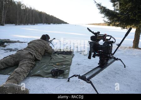 The photograph displays Training Support Activity Europe’s (TSAE) video gear set up during a 2nd Cavalry Regiment, 1st Squadron's live fire exercise with an M107 sniper rifle at the 7th Army Training Command's (7th ATC) Grafenwoehr Training Area,Germany, Jan. 20, 2017.     TSAE’s mission is to Identify, to acquire, to manage and to provide state-of-the-art home station, rotational and expeditionary training support and visual information capability as directed by United States Army Europe, in order to prepare Joint and Multinational forces to win in any operating environment, and serves as the Stock Photo