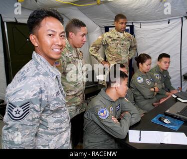 U.S. Air Force Tech. Sgt. Geofrey Erese, Eagle Vision Data Integration Segment non-commissioned officer-in-charge, watches a mapping software demonstration, Clark Air Base, Philippines, Jan. 20, 2017. Erese and his Eagle Vision team have deployed on numerous occasions to support excercises in the Philippines. Over the past week Erese has been supporting a bilateral Subject Matter Expert Exchange concentrated on using satellite imagery and geospatial analysis to enhance the military-to-military relationship between the U.S. and Philippines. The information shared during the SMEE will hopefully  Stock Photo