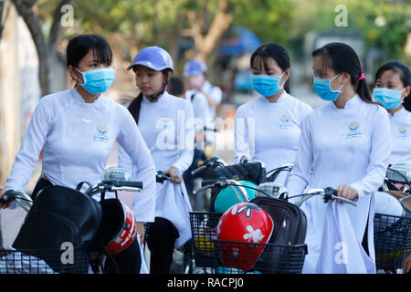 Students dressed in Ao Dai on the way to school, Cai Be, Vietnam, Indochina, Southeast Asia, Asia Stock Photo