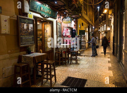 Typical street in Malaga at night with bars and terraces, Malaga Spain. Stock Photo