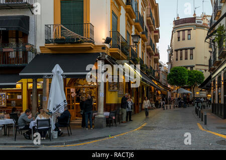 Narrow street in the historical centre at dusk, Seville, Andalusia, Spain, Europe Stock Photo