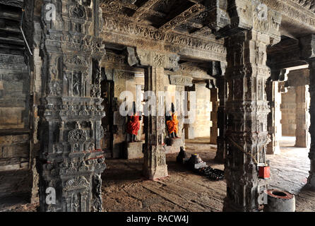 Two dressed deities at shrine inside pillared hall in 11th century Gangaikonda Cholapuram temple, UNESCO, Ariyalur district, Tamil Nadu, India, Asia Stock Photo