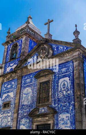 Facade of Chapel of Souls, covered with azulejo blue and white painted ceramic tiles, Capela das Almas Church, Porto, Portugal, Europe Stock Photo