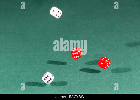 White, red and blue dices falling Stock Photo