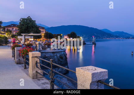 View of lakeside restaurants at dusk in Stresa, Lago Maggiore, Piedmont, Italian Lakes, Italy, Europe Stock Photo