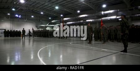 U.S. Marines and Romanian forces stand together at attention at the introduction of the transfer of authority ceremony on Mihail Kogalniceanu Air Base, Romania, Jan. 26, 2017. BSRF 16.2 was relieved by BSRF 17.1 after their six month deployment that included operations with 14 partner nations in Europe. Stock Photo