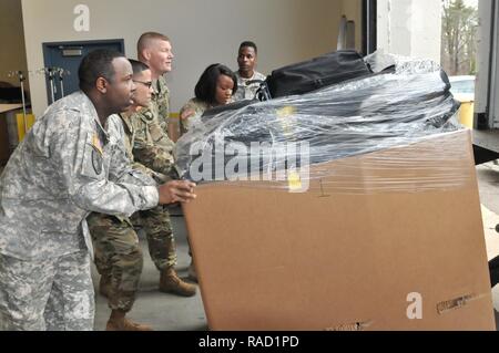 Soldiers assigned to Army Reserve Medical Command and the Fort Belvoir Community Hospital, assemble medical supplies for aid stations to be used in the capitol region to potentially treat servicemembers, families, and the general public attending inaugural activities. Left to Right: Sgt. John Void, Pfc. Uriel Rivera, Sgt. 1st Class Michael Bennett, Spc. Isabel Kasabiti, and Staff Sgt. Raheem Scott. Stock Photo