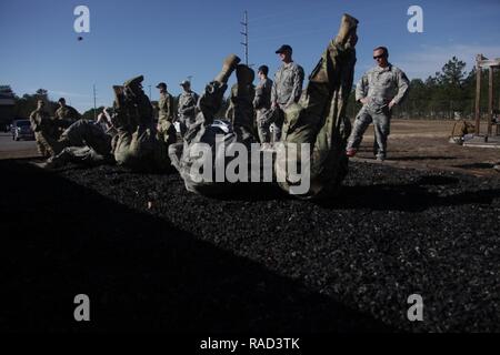 U.S. Army Paratroopers assigned to 360th Civil Affairs Brigade, 412th Civil Affairs Battalion, 450th Civil Affairs Battalion, preforms parachute landing falls in preparation for a tactical airborne operation, Fort Jackson, S.C., Jan. 26, 2017.The 360th Civil Affairs Brigade host Operation Anvil so jumpmasters and jumpers can maintain currency and jump status. Stock Photo