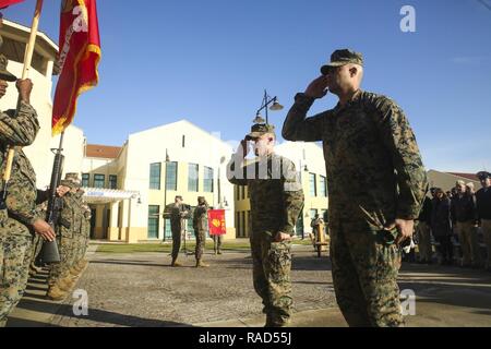Lt. Col. Shawn P. Grzybowski, the commanding officer for Combat Logistics Battalion 8, and Sgt. Maj. Aaron B. Boone, the sergeant major for CLB-8, salute their battalion’s colors during a transfer of authority ceremony for Special Purpose Marine Air-Ground Task Force – Crisis Response – Africa Logistics Combat Element at Naval Air Station Sigonella, Italy, Jan. 25, 2017. SPMAGTF–CR– AF LCE provides logistical support to the entire SPMAGTF enabling the protection of U.S. personnel, property and interests in Europe and Africa. Stock Photo