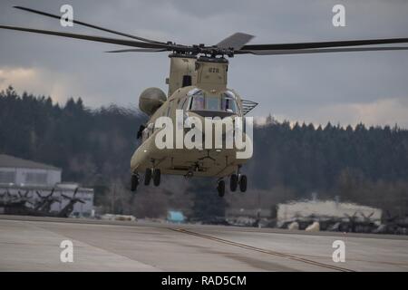 U.S. Army Reserve CH-47 helicopter pilots come in for a landing at  Joint Base Lewis-McChord, Wash., Jan. 26, 2017. The pilots and their crew  were supporting Forward Area Refueling Equipment training with U.S. Army  Soldiers assigned to 16th Combat Aviation Brigade, 7th Infantry Division to  help prepare the unit for its upcoming mission in Afghanistan.