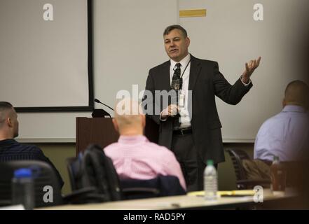 Gregg T. Habel, executive director, Marine Forces Reserve and Marine Forces North speaks to Marines and Sailors about the importance discussing equal opportunity issues during the Senior Leadership Workshop aboard Marine Corps Support Facility New Orleans, Feb. 23-26, 2017. The workshop aims to emphasize the importance of open communication and equal opportunity, and to demonstrate their effects on unit cohesion, mission accomplishment and mission readiness. Stock Photo