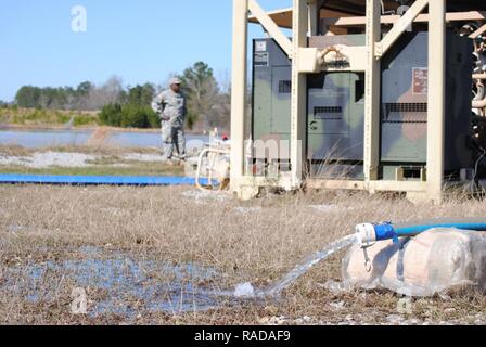 Fresh water flows after being purified by Soldiers from Alpha Company, 351st Aviation Support Battalion Jan. 31 at Hagler Pond on Camp Shelby during the PATRIOT South 17 exercise. (Air National Guard Stock Photo