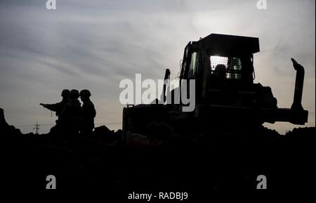 U.S. Marines with Alpha Company, 9th Engineer Support Battalion, 3rd Marine Logistics Group, use Bulldozers to dig tank ditch during the exercise Korean Marine Exchange Program (KMEP) 17-8 on New Mexico Range, South Korea, January 28, 2017. KMEP is an annually scheduled training event designed to enhance to improve the tactical interoperability and camaraderie of the Republic of Korea (ROK) and U.S. Marines by allowing them to work side-by-side as a cohesive unit. The alliance between America and the Republic of Korea has grown even stronger based upon the shared interests and values of both n Stock Photo