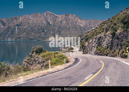 Twisty roads along lake Hawea in New Zealand Stock Photo