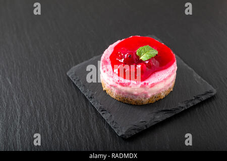 Food concept homemade organic Red currants mousse cheese cake with copy space Stock Photo