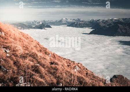 Lake Lucerne swimming in clouds seen from above from Mount Pilatus, Switzerland Stock Photo