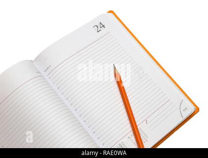opened notepad and pencil on a white close up shoot Stock Photo