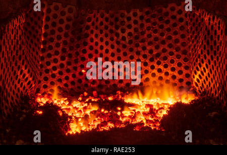 Burning pellets in a fireplace Stock Photo