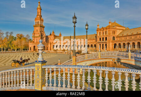 PALACIO ESPANOL IN THE PARQUE DE MARIA LUISA SEVILLE SPAIN THREE BLUE AND WHITE TILED BRIDGES OVER THE CANAL Stock Photo