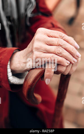 Focused photo on stick that being in female hands Stock Photo