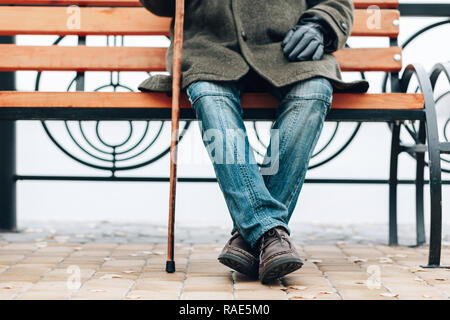 Focused photo on male legs that being crosses Stock Photo