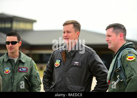 From left, U.S. Air Force Maj. Daniel Dickinson, F-22 Raptor Demonstration Team commander, U.S. Air Force Lt. Col. Christopher McAlear, Air Combat Command chief of aerial events, and U.S. Air Force Capt. John Waters, F-16 Viper Demonstration Team pilot, meet after the F-16 Vipers landed at Joint Base Langley-Eustis, Va., Jan. 31, 2017. Waters traveled to JBLE with is team to complete a Commander of the Air Combat Command certification, ensuring he is capable of flying with the demo team. Stock Photo