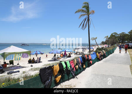 Lifejackets hanging next to the beach at Little Nelson Bay, Nelson Bay, Port Stephens, Australia Stock Photo