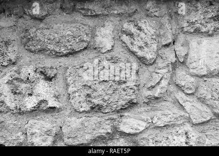 Old grunge stone background. Horizontal black and white color photography. Stock Photo
