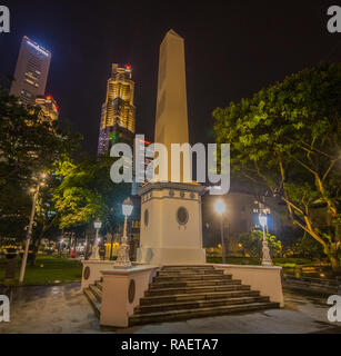 Dalhousie Obelisk, a monument at Empress Place in downtown Singapore was built to remind merchants of the benefits of free trade in 1850. Stock Photo