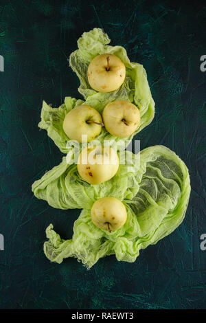 Fresh green apples on dark green background Stock Photo
