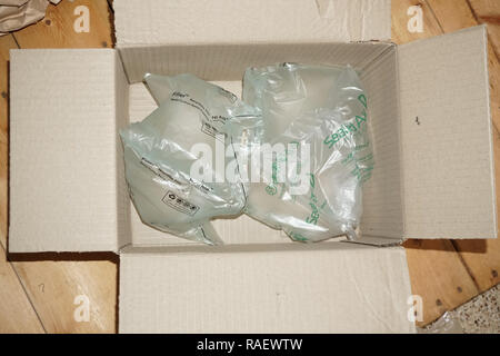 Protective plastic sealed air bubble packing in a cardboard box