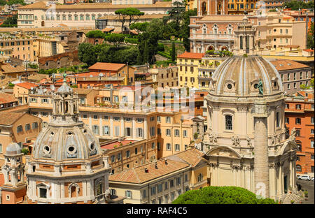 Domes churches of Santa Maria di Loreto and Santissimo Nome di Maria (Most Holy Name of Mary) and roofs of houses in square of Venice,Rome,Italy Stock Photo