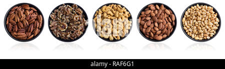 Close-up View from above of healthy Pecans, Walnuts, Cashews, Almonds and Peanuts. Closeup of different Nuts in a Bowl reflecting on white Background. Stock Photo