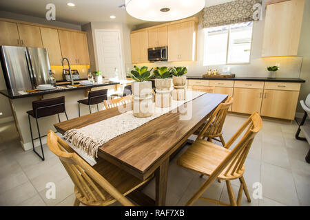 Wooden Table And Chairs With Centerpieces Off Modern Kitchen Stock Photo