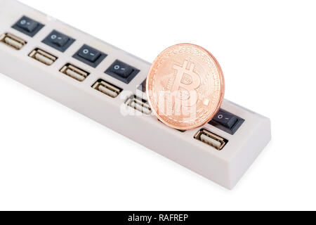 Bitcoin souvenir coins on the bar with usb connectors isolated on white background Stock Photo