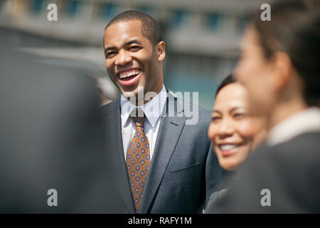 Young businesspeople laughing together. Stock Photo
