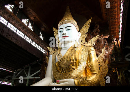 Buddha in gold, royal clothes,Ngar Htat Gyee pagoda,Yangon, Myanmar(Burma) Stock Photo