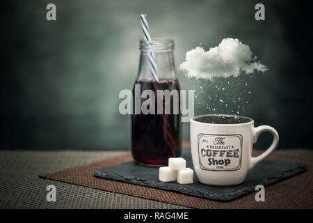 Surreal photo of fresh juice and coffee mug with cloud and the snow falling Stock Photo