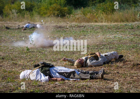 Historical festival Sambek Heights. Grenade explosion on the background of dead soldiers on battlefield Stock Photo