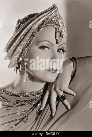 Greta Garbo, 1905-1990.  Swedish born actress who later took American citizenship.  This photograph shows her in costume for the 1931 Metro-Goldwyn-Mayer production of Mata Hari. Stock Photo