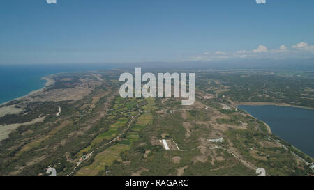 Aerial view of beautiful beach, lagoons and Paoay lake. Philippines, Luzon, Ilocos Norte. Coast ocean with turquoise water. Tropical landscape in Asia. Stock Photo