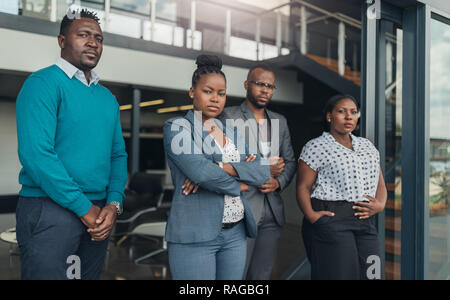 Corporate african american team standing with confidence Stock Photo