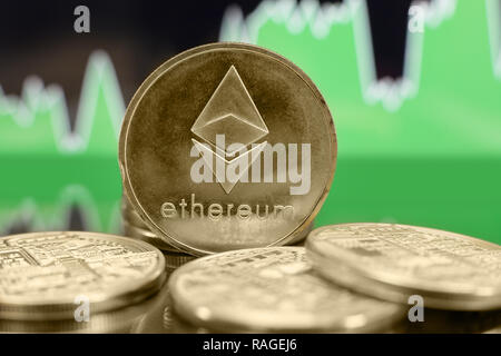 Ethereum ETH cryptocurrency coin on the green chart background. Bubble or bull trend concept. Stock Photo