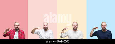 Collage of young man with beard over colorful stripes isolated background gesturing with hands showing big and large size sign, measure symbol. Smilin Stock Photo