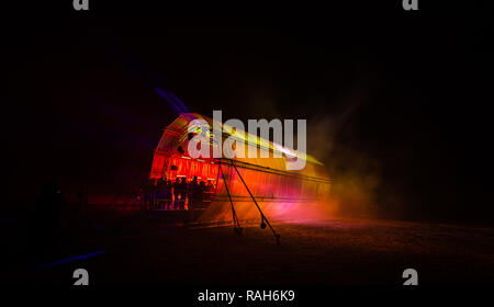 Futuristic abstract glowing colorful photon tunnel light by blue DMX lights Stock Photo